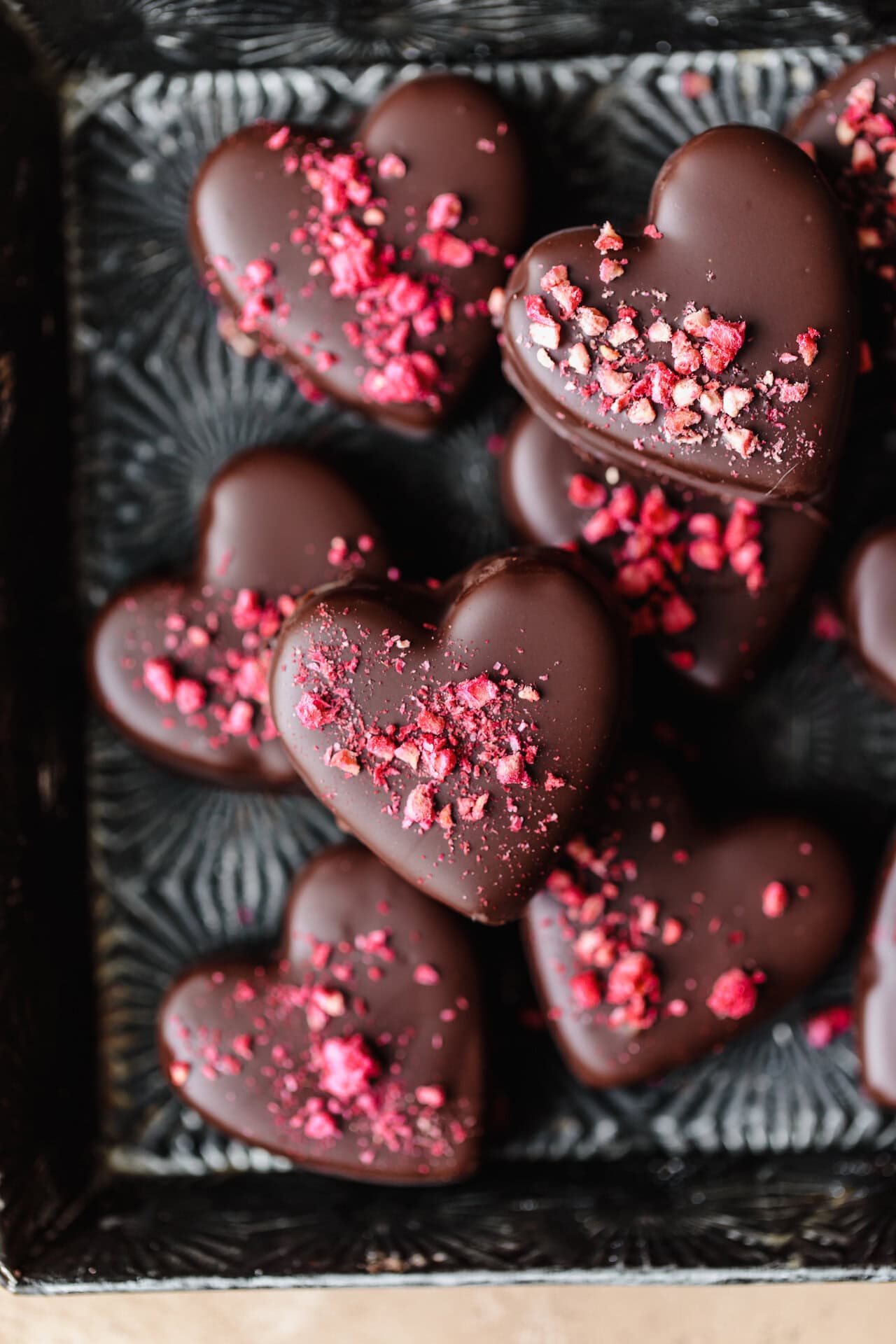 Heart-shaped chocolates with pink sprinkles for Delight Fuel.