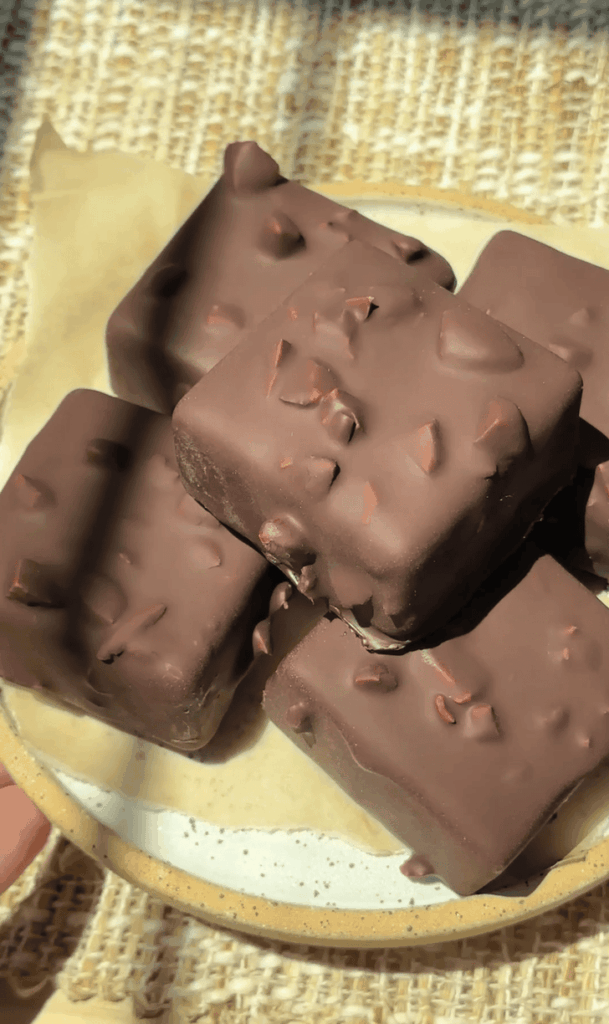 Delight Fuel chocolate bars with nuts on a plate for a healthy snack.