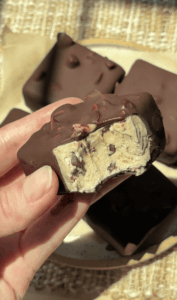 Close-up of Delight Fuel chocolate bar with nuts and creamy filling.