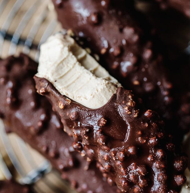 Close-up of Delight Fuel chocolate bar with nuts and creamy filling.